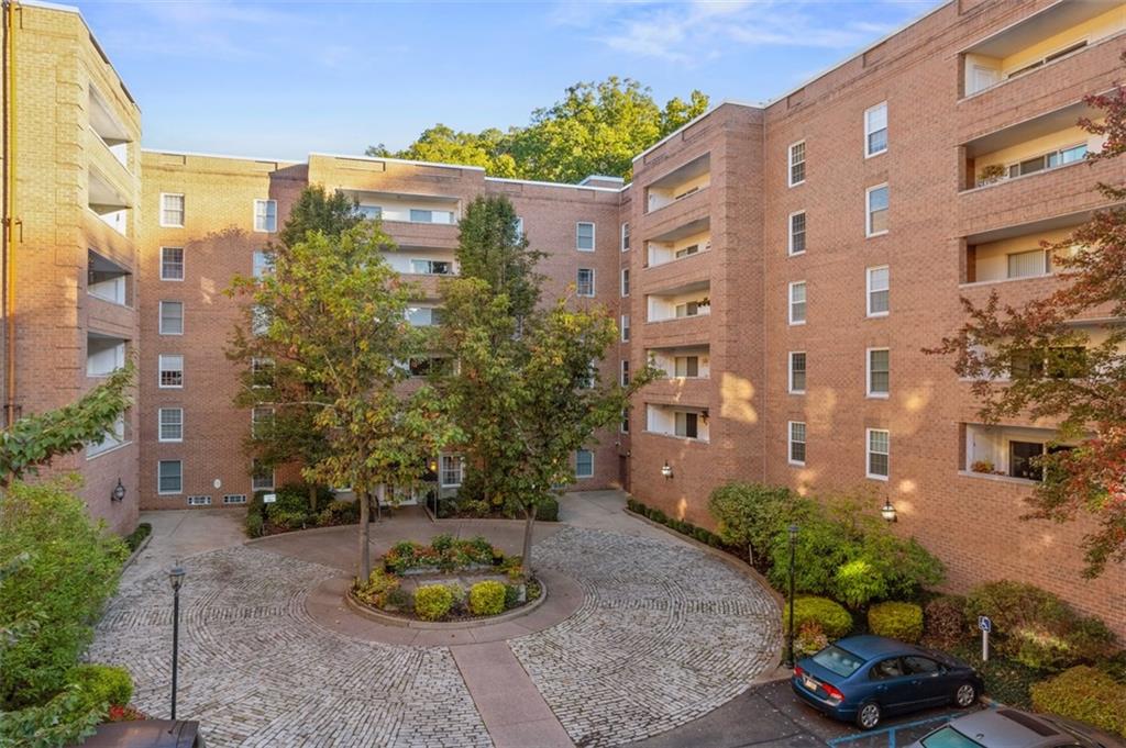 302 Fox Chapel Road, Unit 613 Pittsburgh, PA 15238 - Photo 3 of 37 a front view of a multi story residential apartment building with a yard