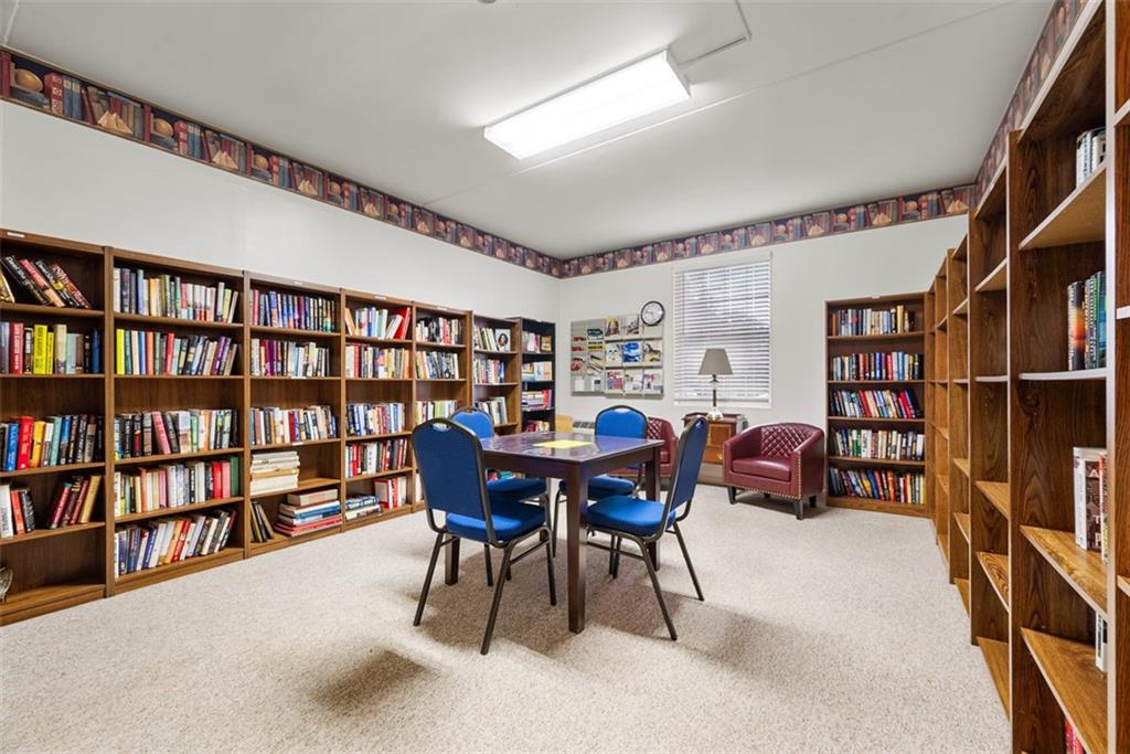 302 Fox Chapel Road, Unit 613 Pittsburgh, PA 15238 - Photo 32 of 37 a view of a livingroom with furniture and bookshelf