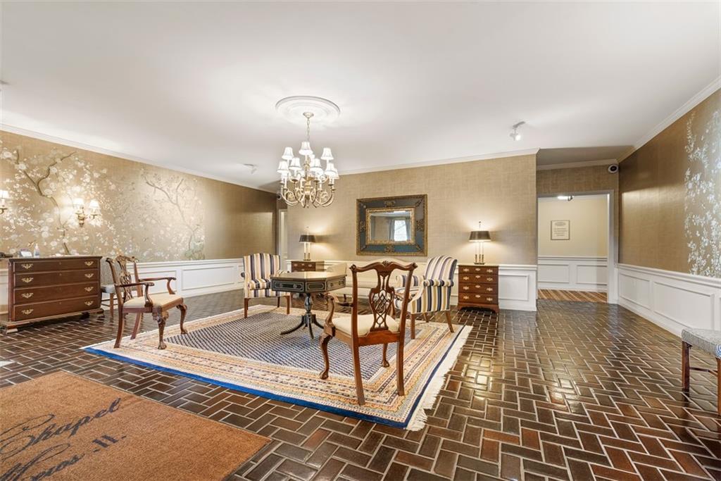 302 Fox Chapel Road, Unit 613 Pittsburgh, PA 15238 - Photo 37 of 37 a view of a dining room with furniture a chandelier and wooden floor