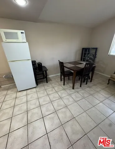 a view of a workspace with furniture