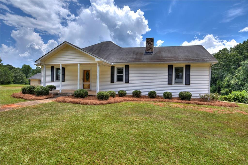 556 Dot Road Bowdon, GA 30108 - Photo 1 of 1 a front view of a house with yard and green space