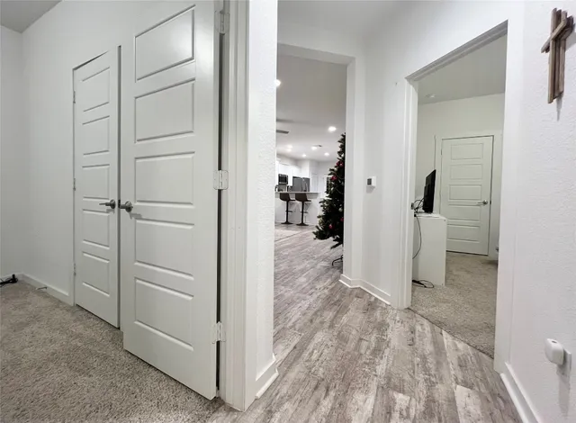 a kitchen with stainless steel appliances kitchen island granite countertop a refrigerator and a stove top oven