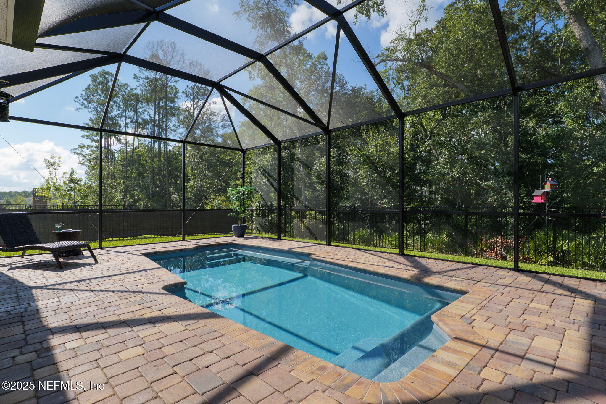 a view of a swimming pool with a patio