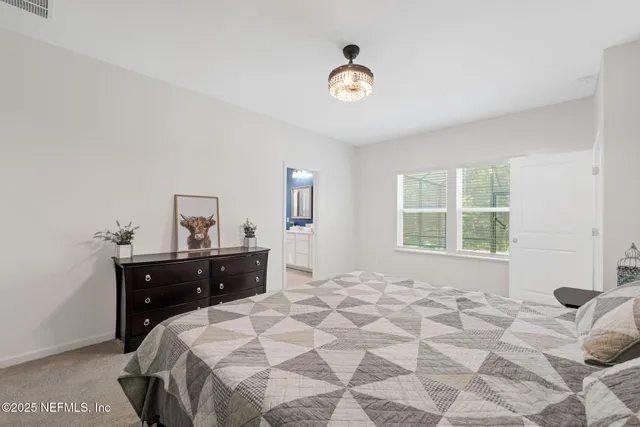 a work room with large windows and wooden floor
