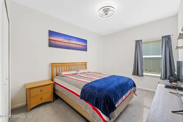 a view of a patio with a table and chairs