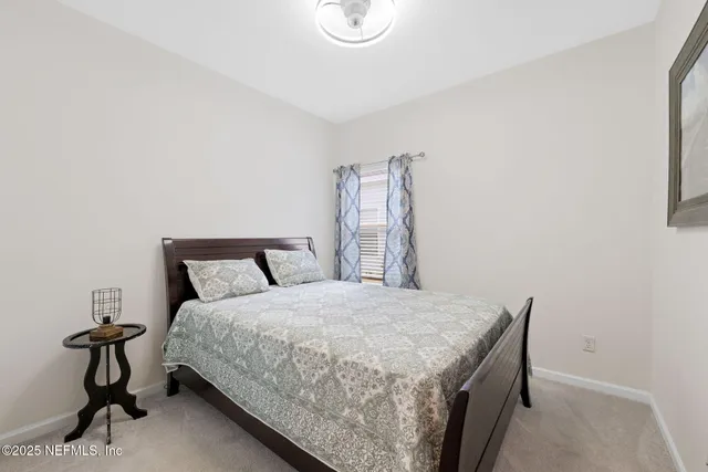 a view of a house with backyard and porch