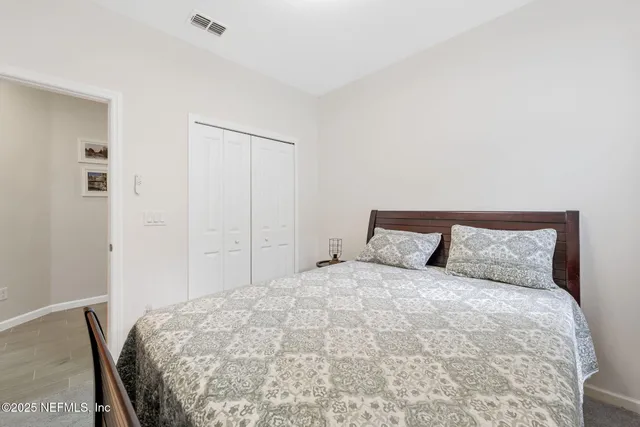 a view of a backyard with a garden and outdoor seating