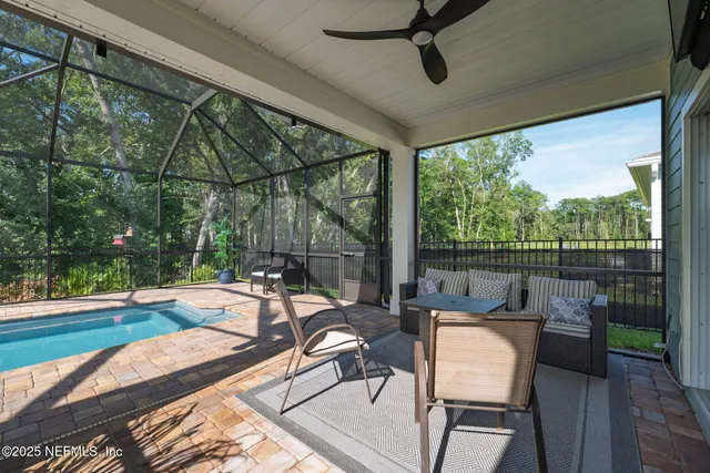 an aerial view of a city with lots of residential buildings ocean and mountain view