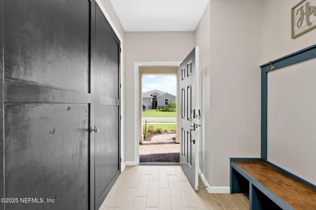 a view of a room with wooden floor