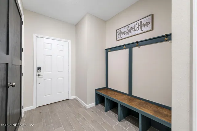 a kitchen with sink and refrigerator