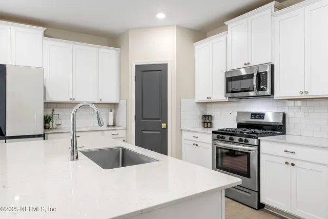 a hallway with a dining table and chairs