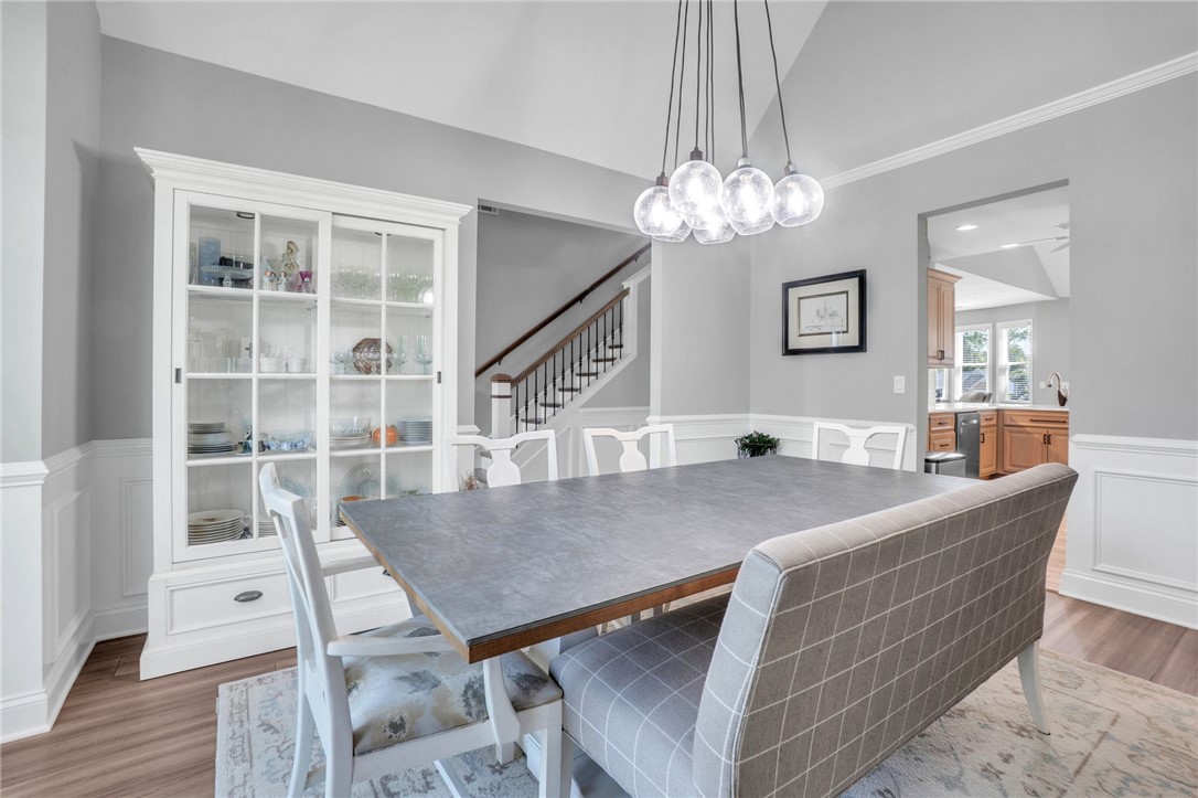 116 Stone Cottage Drive Anderson, SC 29621 - Photo 10 of 43 Vaulted ceilings and elegant wainscoting highlight this refined formal dining room.