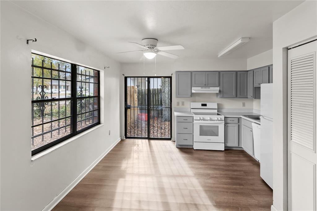 1018 Southwest 60 Terrace, Unit A Gainesville, FL 32607 - Photo 6 of 11 a kitchen with stainless steel appliances a stove a sink and a refrigerator