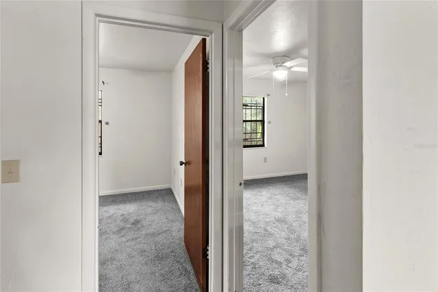 a view of a hallway with a rooms