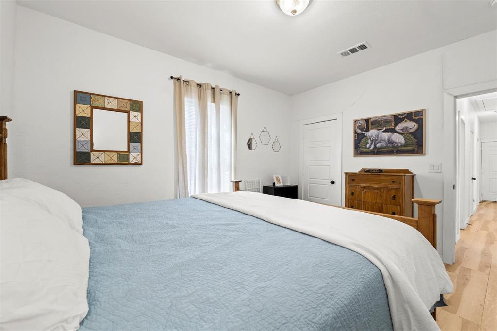 3100 North 27th Street Waco, TX 76708 - Photo 12 of 27 a bedroom with a bed and a painting on the wall