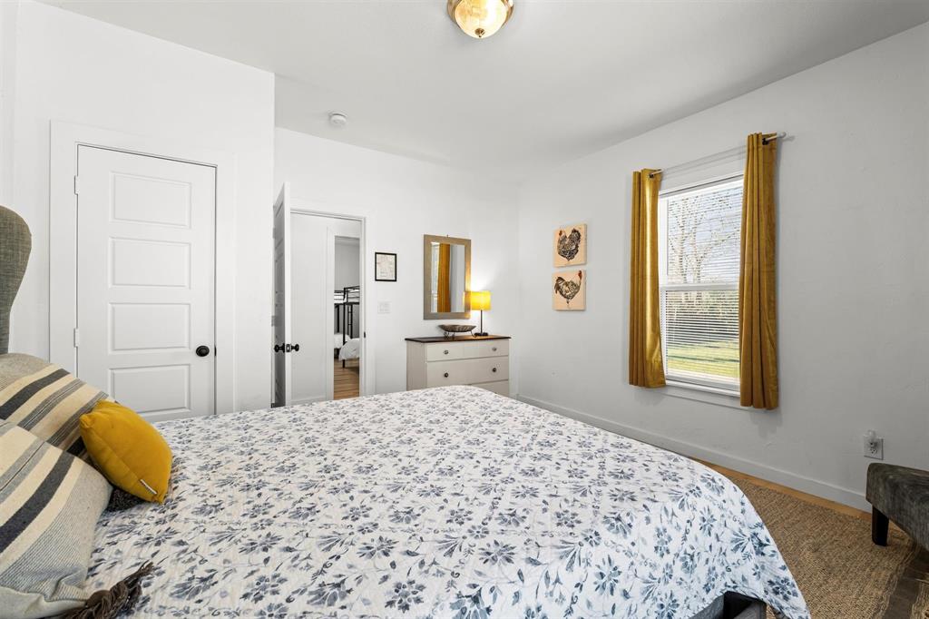 3100 North 27th Street Waco, TX 76708 - Photo 15 of 27 a bedroom with a bed and a window