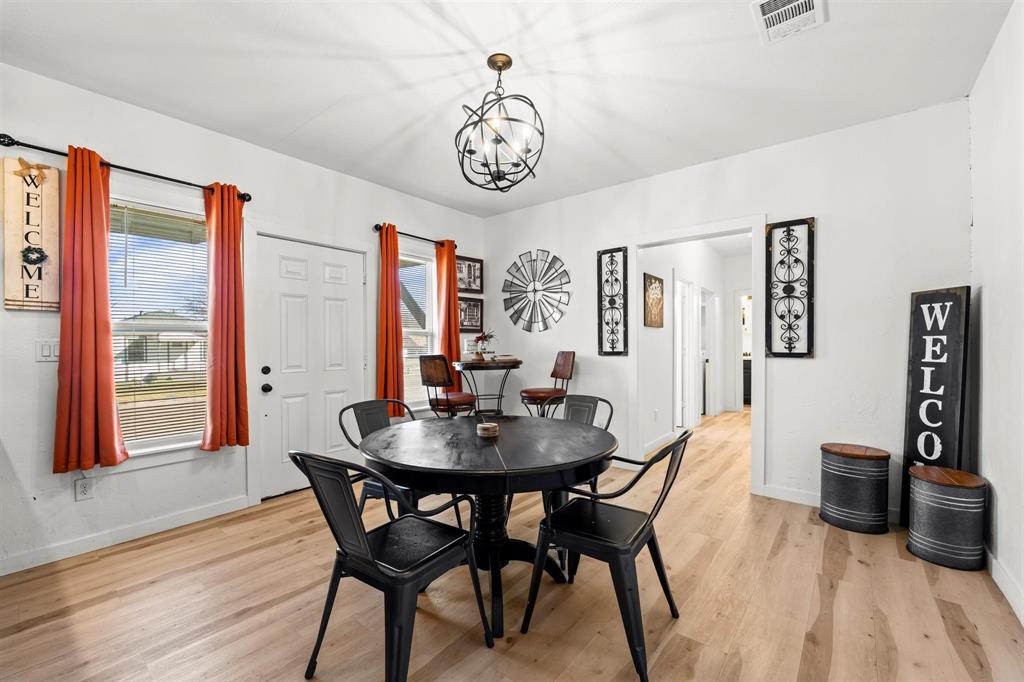 3100 North 27th Street Waco, TX 76708 - Photo 5 of 27 a view of a dining room with furniture window and wooden floor
