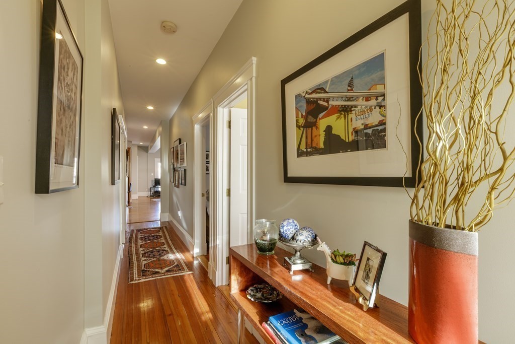 273-275 Concord Avenue, Unit 2 Cambridge, MA 02138 - Photo 12 of 24 a living room with furniture and a gate