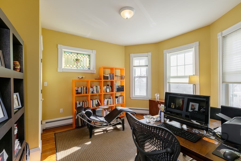 273-275 Concord Avenue, Unit 2 Cambridge, MA 02138 - Photo 13 of 24 a living room with furniture a flat screen tv and a window