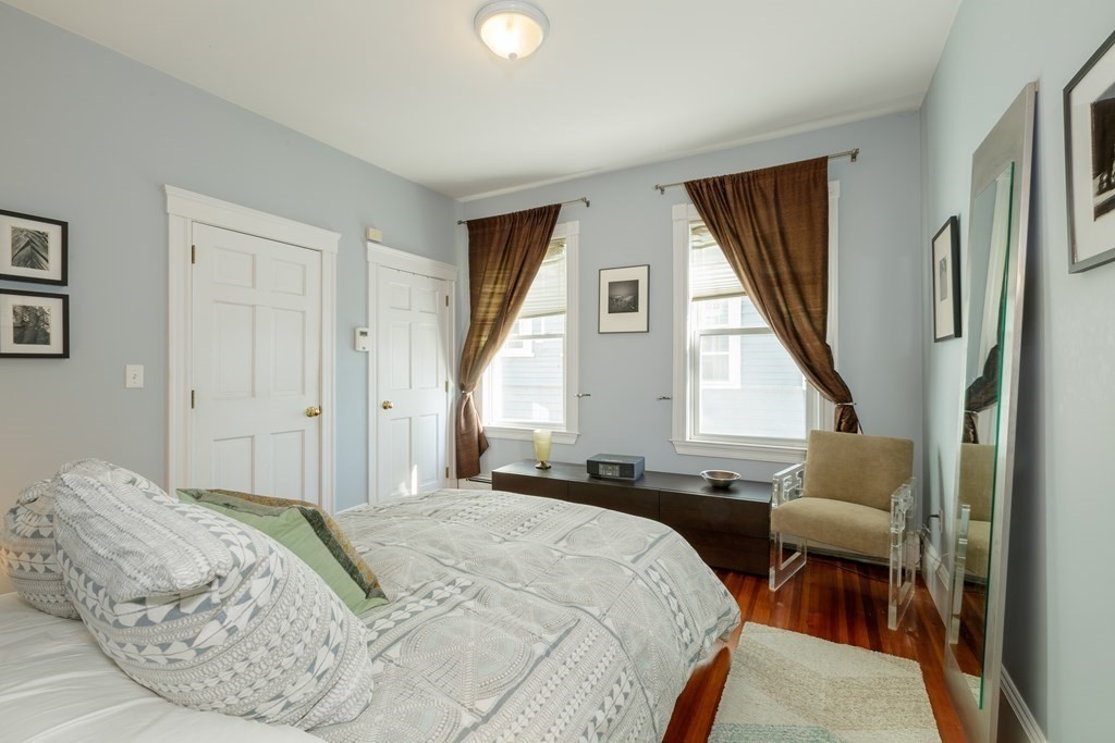 273-275 Concord Avenue, Unit 2 Cambridge, MA 02138 - Photo 14 of 24 a bedroom with a bed and a window