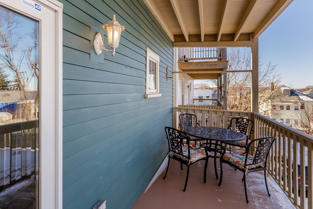 273-275 Concord Avenue, Unit 2 Cambridge, MA 02138 - Photo 19 of 24 a view of a balcony with furniture