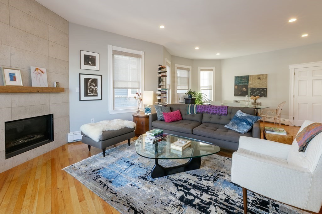 273-275 Concord Avenue, Unit 2 Cambridge, MA 02138 - Photo 2 of 24 a living room with furniture and a fireplace