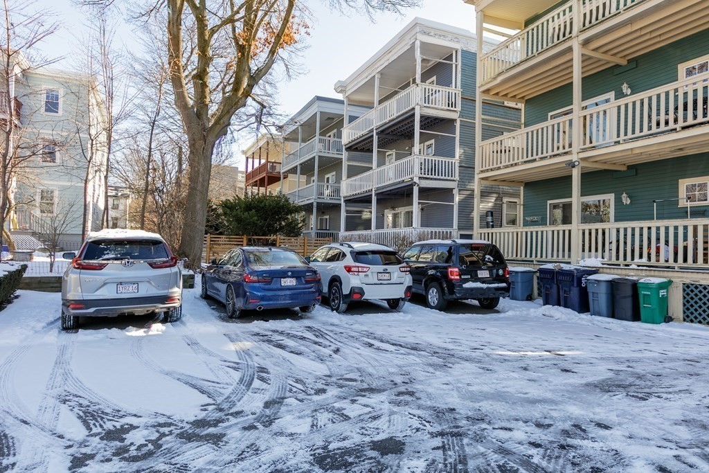 273-275 Concord Avenue, Unit 2 Cambridge, MA 02138 - Photo 21 of 24 a car parked in front of a brick building