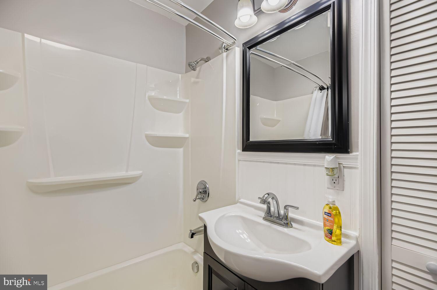 107 Calvary Road Churchville, MD 21028 - Photo 14 of 31 a bathroom with a sink toilet and a mirror