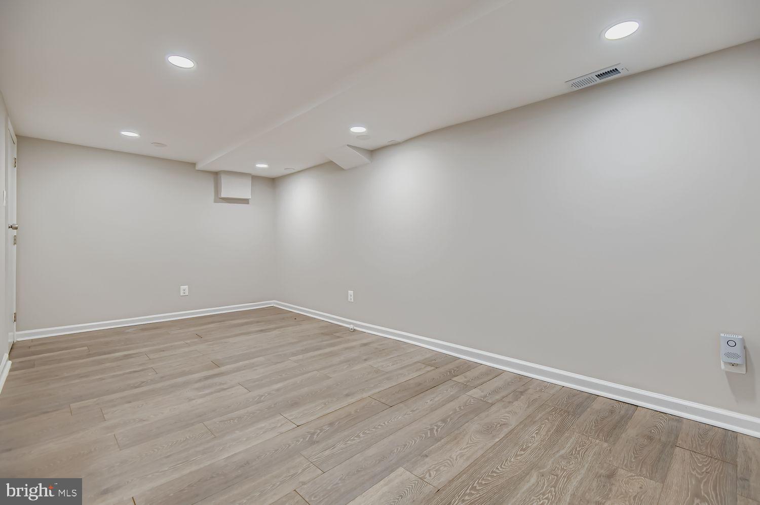 107 Calvary Road Churchville, MD 21028 - Photo 22 of 31 an empty room with wooden floor and windows