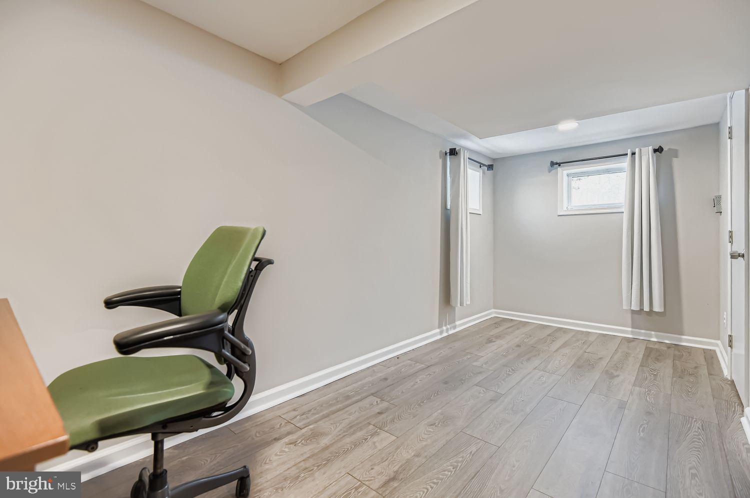 107 Calvary Road Churchville, MD 21028 - Photo 25 of 31 a room with a chair and wooden floor