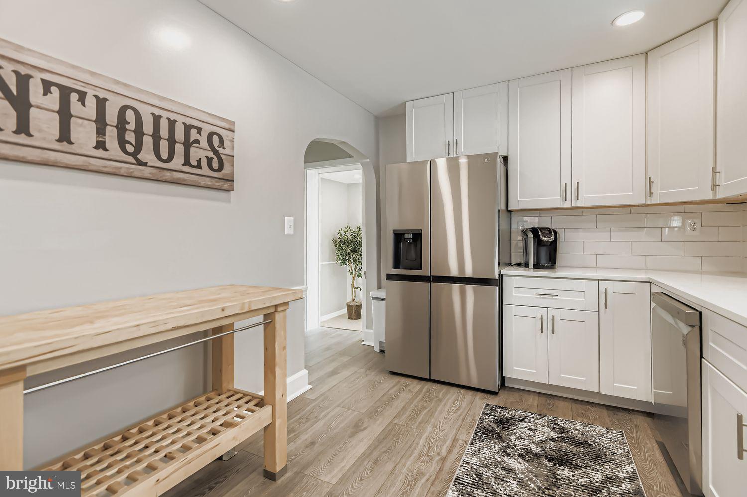107 Calvary Road Churchville, MD 21028 - Photo 7 of 31 a kitchen with stainless steel appliances a refrigerator sink and cabinets