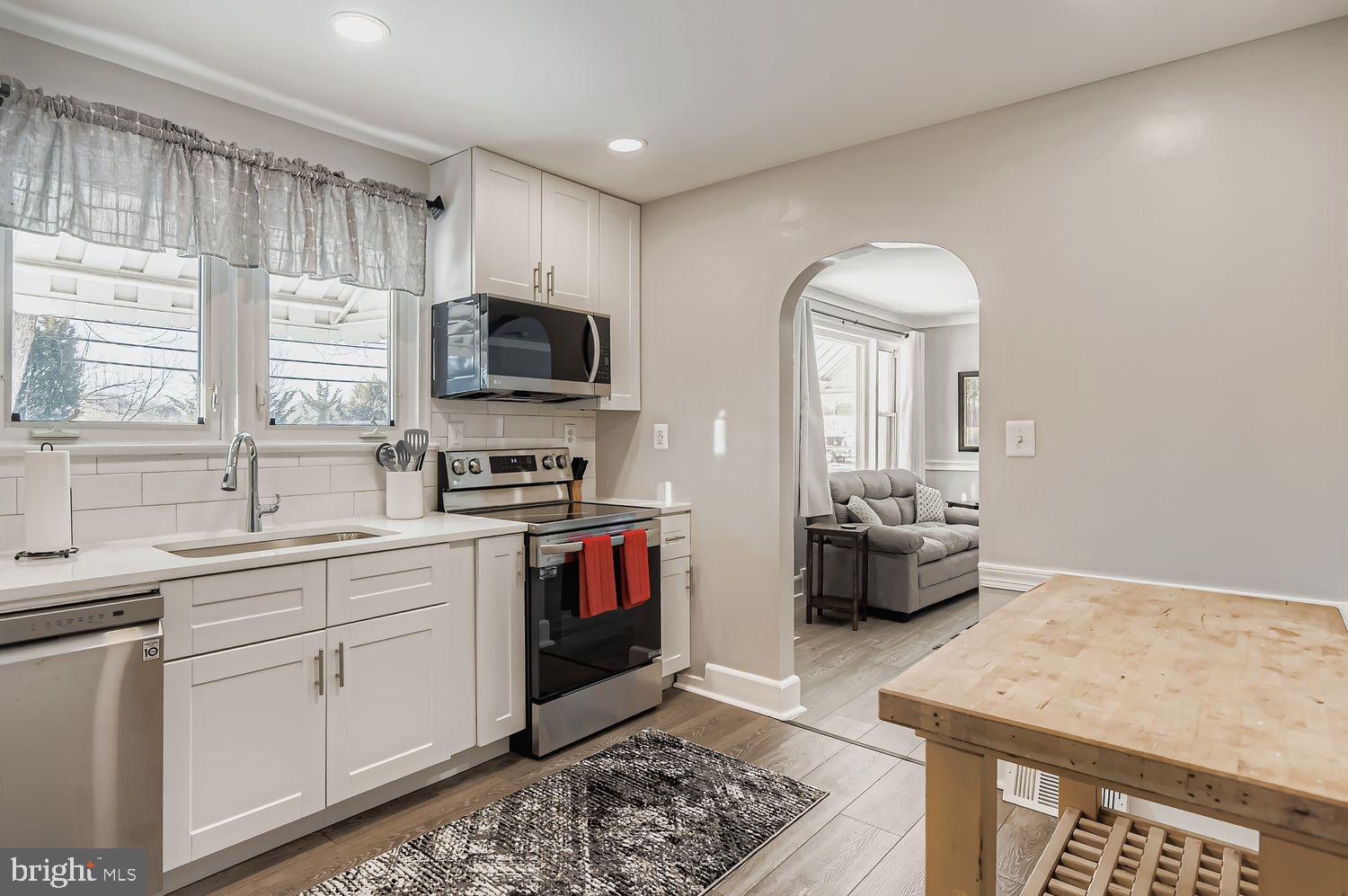 107 Calvary Road Churchville, MD 21028 - Photo 8 of 31 a kitchen with a sink stove and microwave