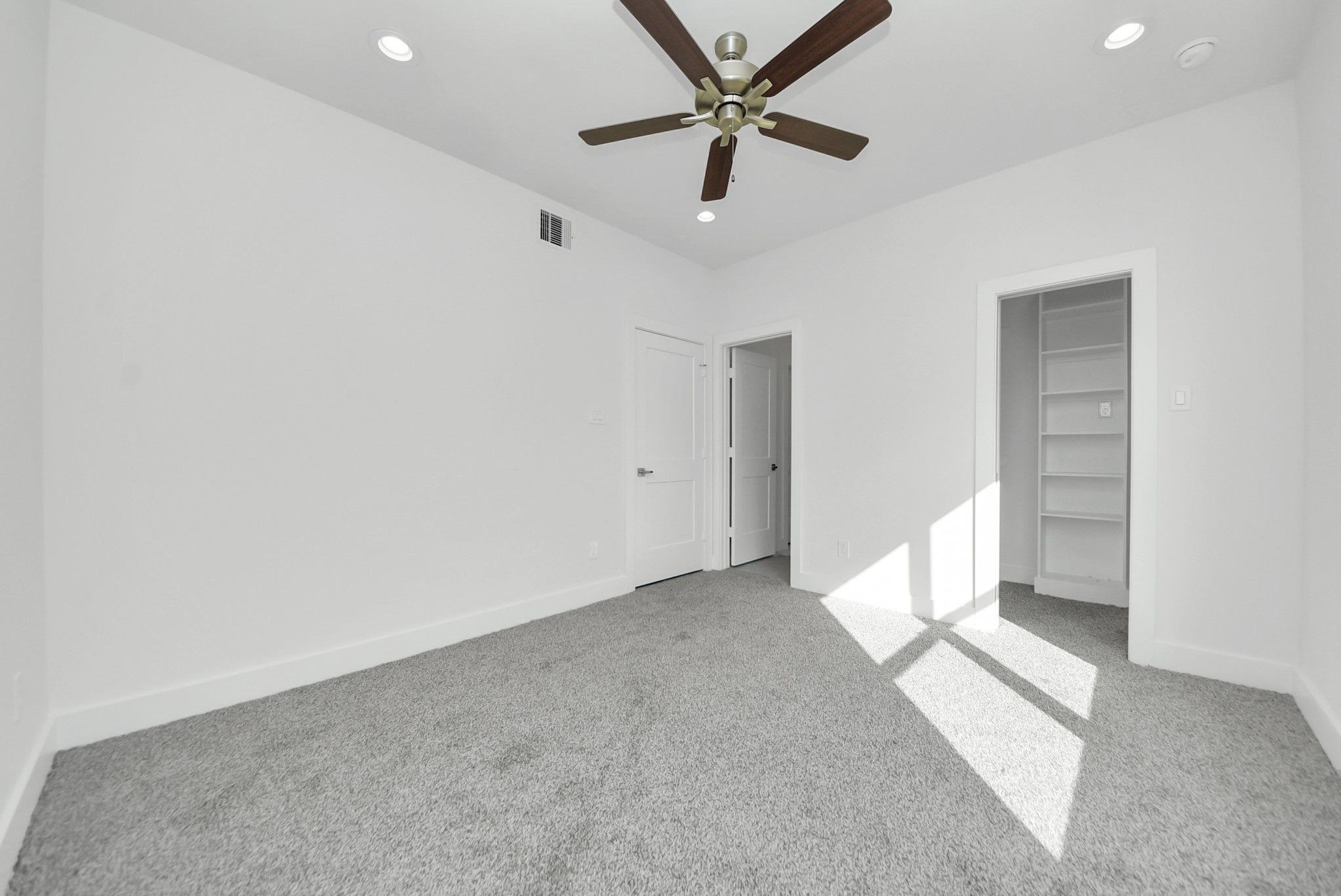 611 East 39th Street, Unit D Houston, TX 77022 - Photo 24 of 33 wooden floor in an empty room with a window
