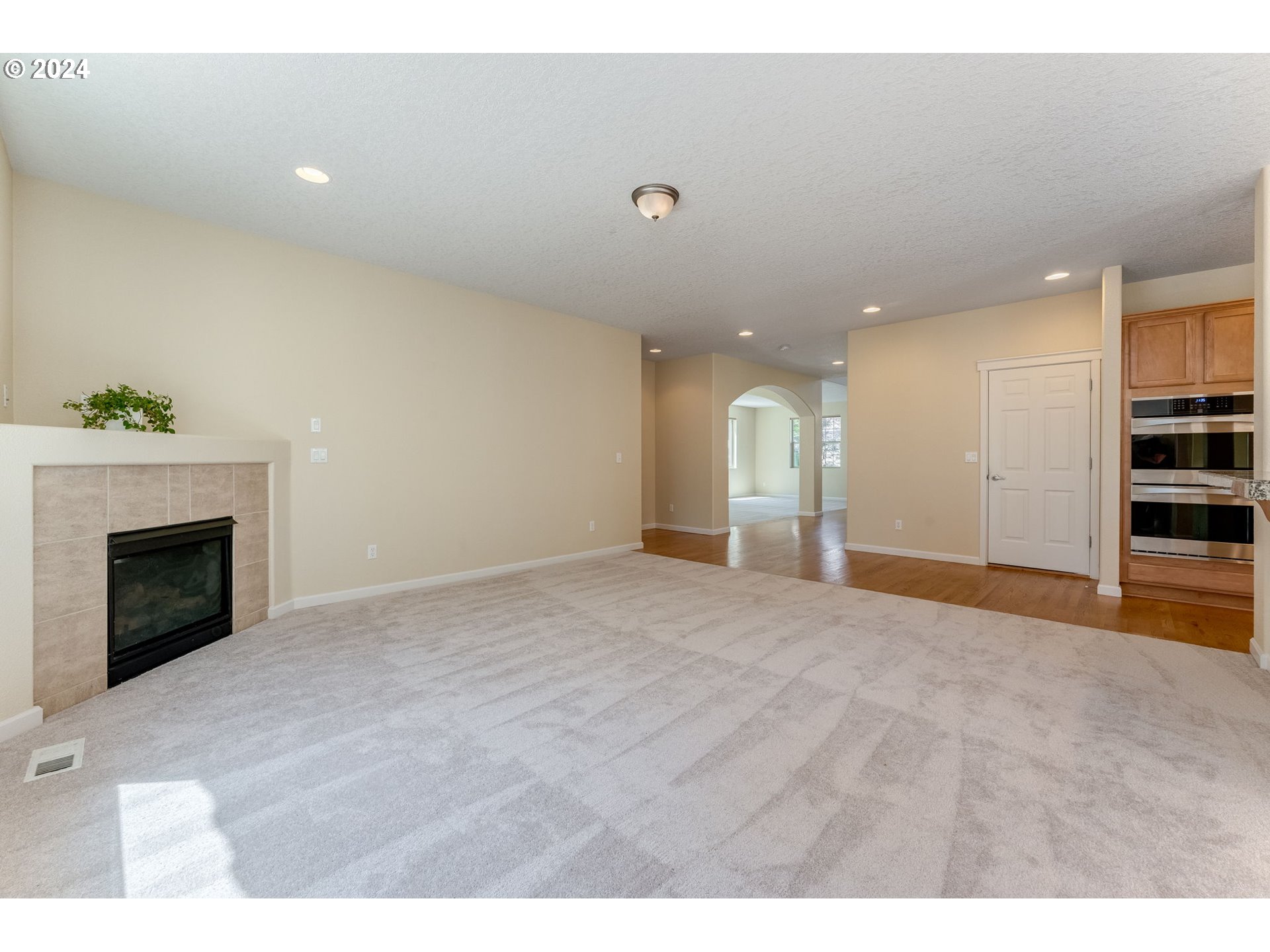 768 North 28th Avenue Cornelius, OR 97113 - Photo 13 of 40 a view of an empty room with a fireplace