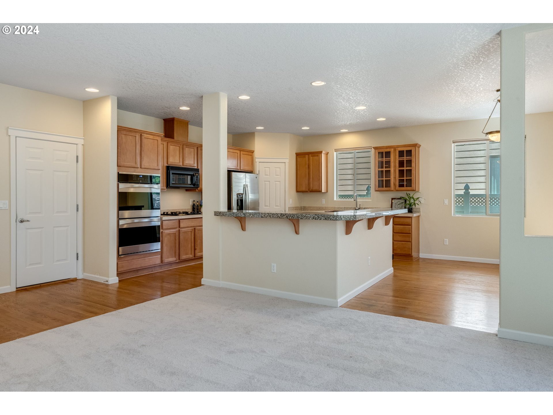 768 North 28th Avenue Cornelius, OR 97113 - Photo 14 of 40 a view of kitchen with wooden floor