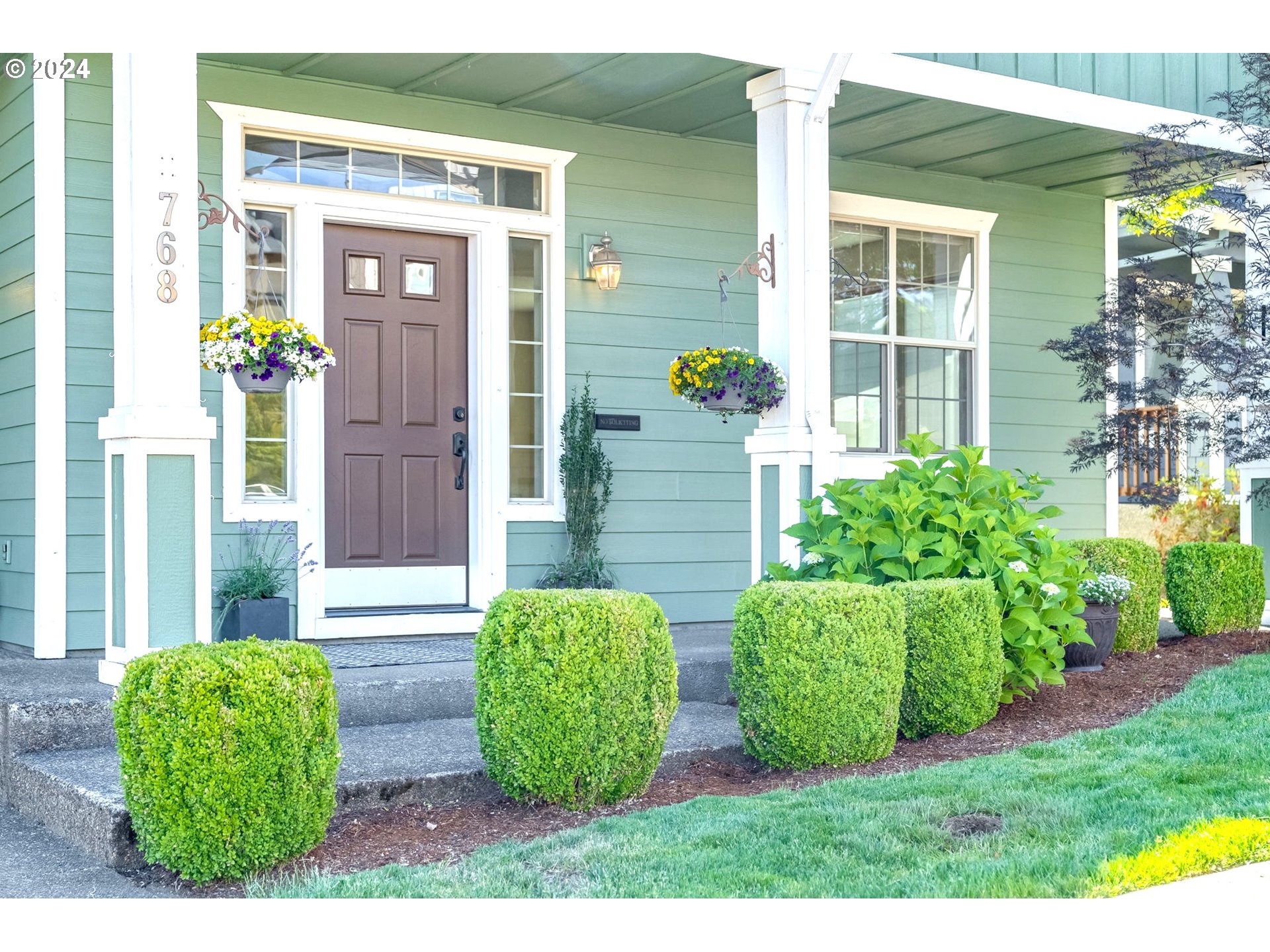 768 North 28th Avenue Cornelius, OR 97113 - Photo 2 of 40 a view of front of a house with a garden
