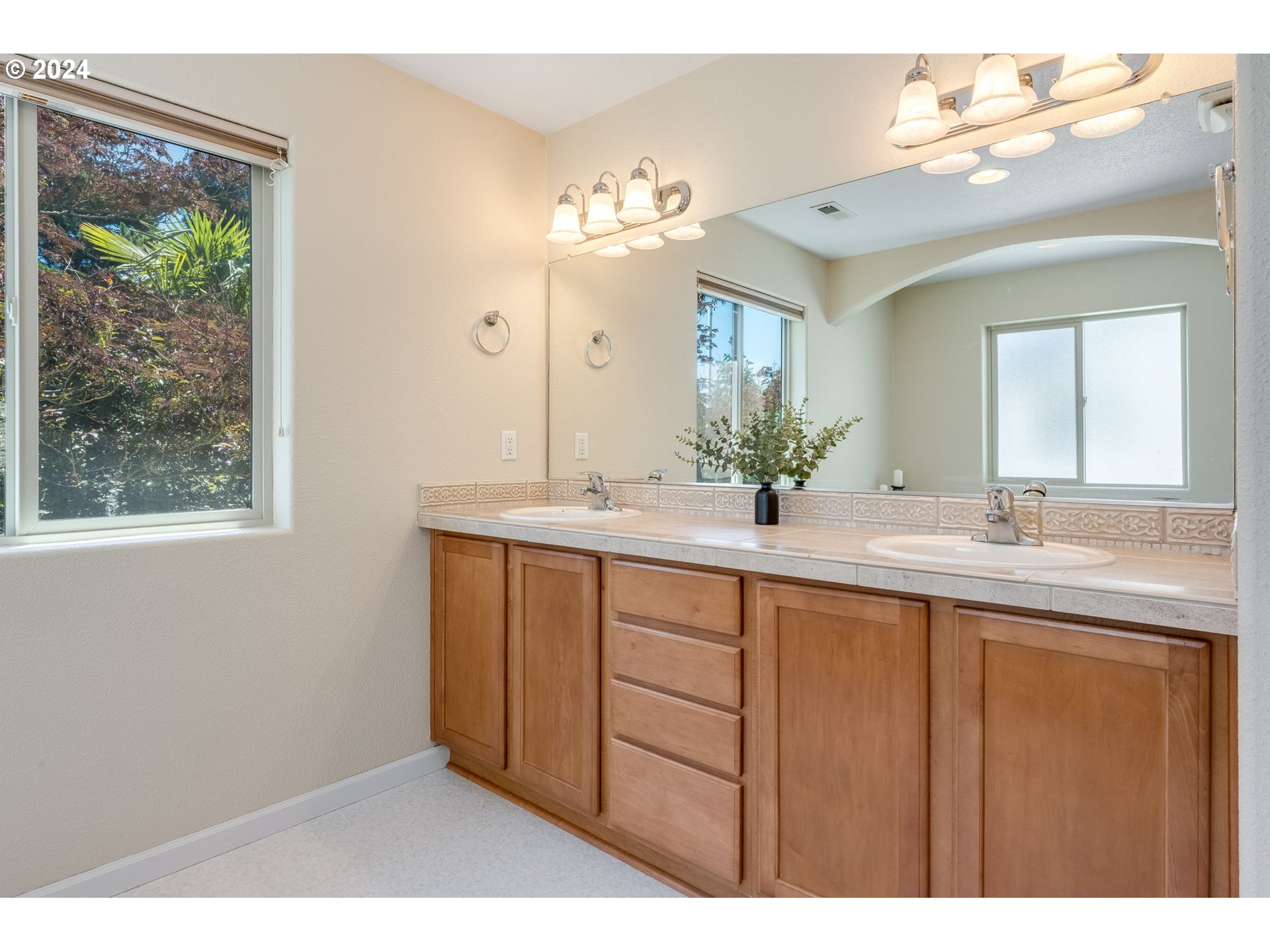 768 North 28th Avenue Cornelius, OR 97113 - Photo 26 of 40 a bathroom with a double vanity sink and a mirror
