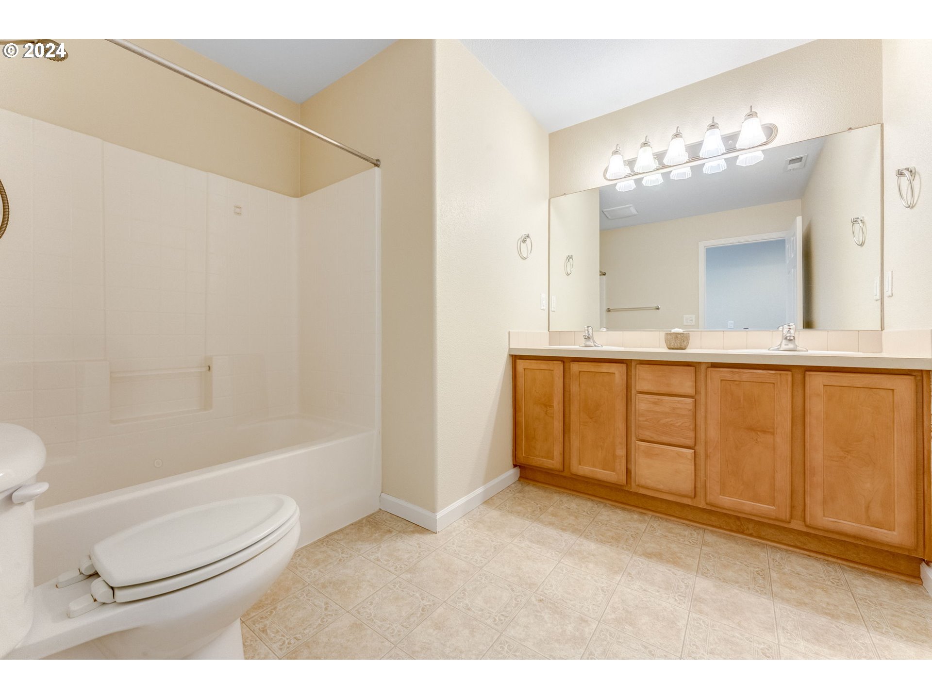 768 North 28th Avenue Cornelius, OR 97113 - Photo 36 of 40 a bathroom with a sink a toilet a mirror a vanity and bathtub