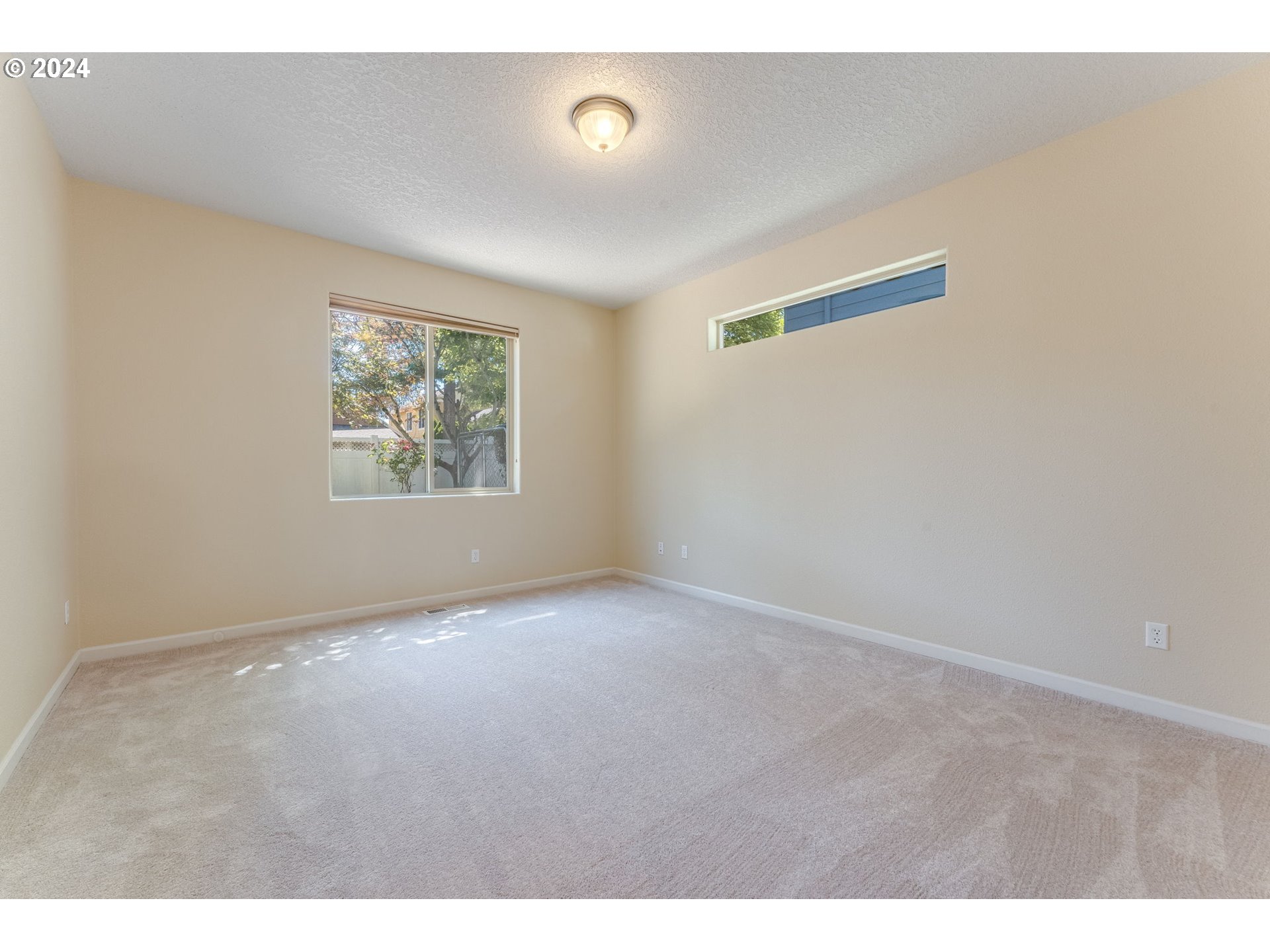 768 North 28th Avenue Cornelius, OR 97113 - Photo 8 of 40 a view of an empty room with a window