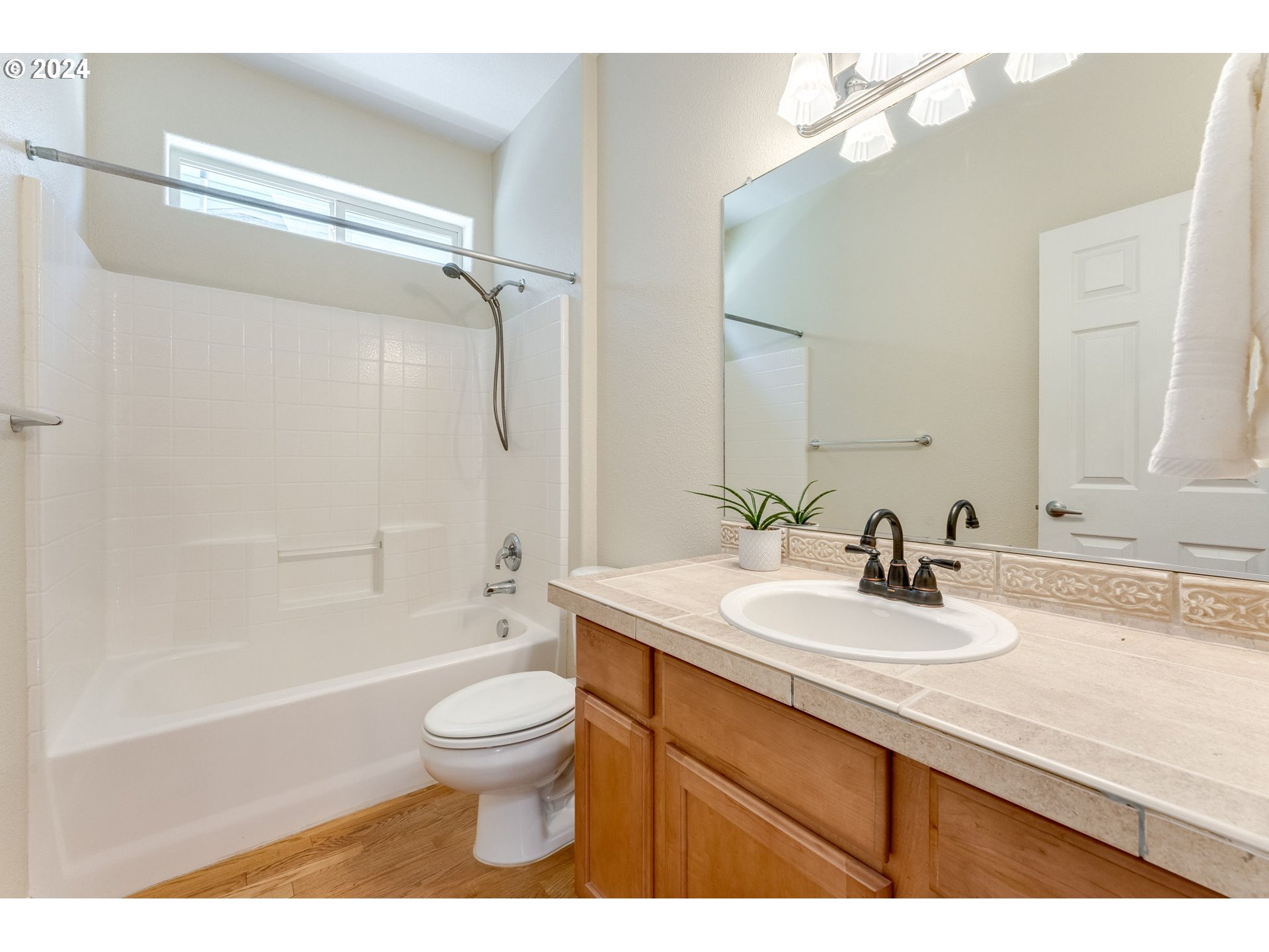768 North 28th Avenue Cornelius, OR 97113 - Photo 10 of 40 a bathroom with a sink a toilet and a mirror
