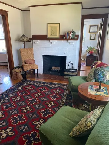 a living room with a couch and a fireplace