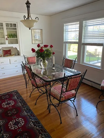 a view of a dining room with furniture and window