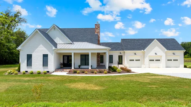 a living room with furniture flat screen tv and a fireplace
