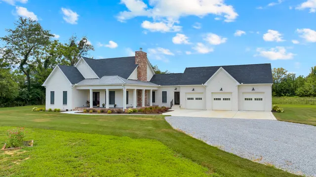 a large kitchen with stainless steel appliances kitchen island a large island in the center