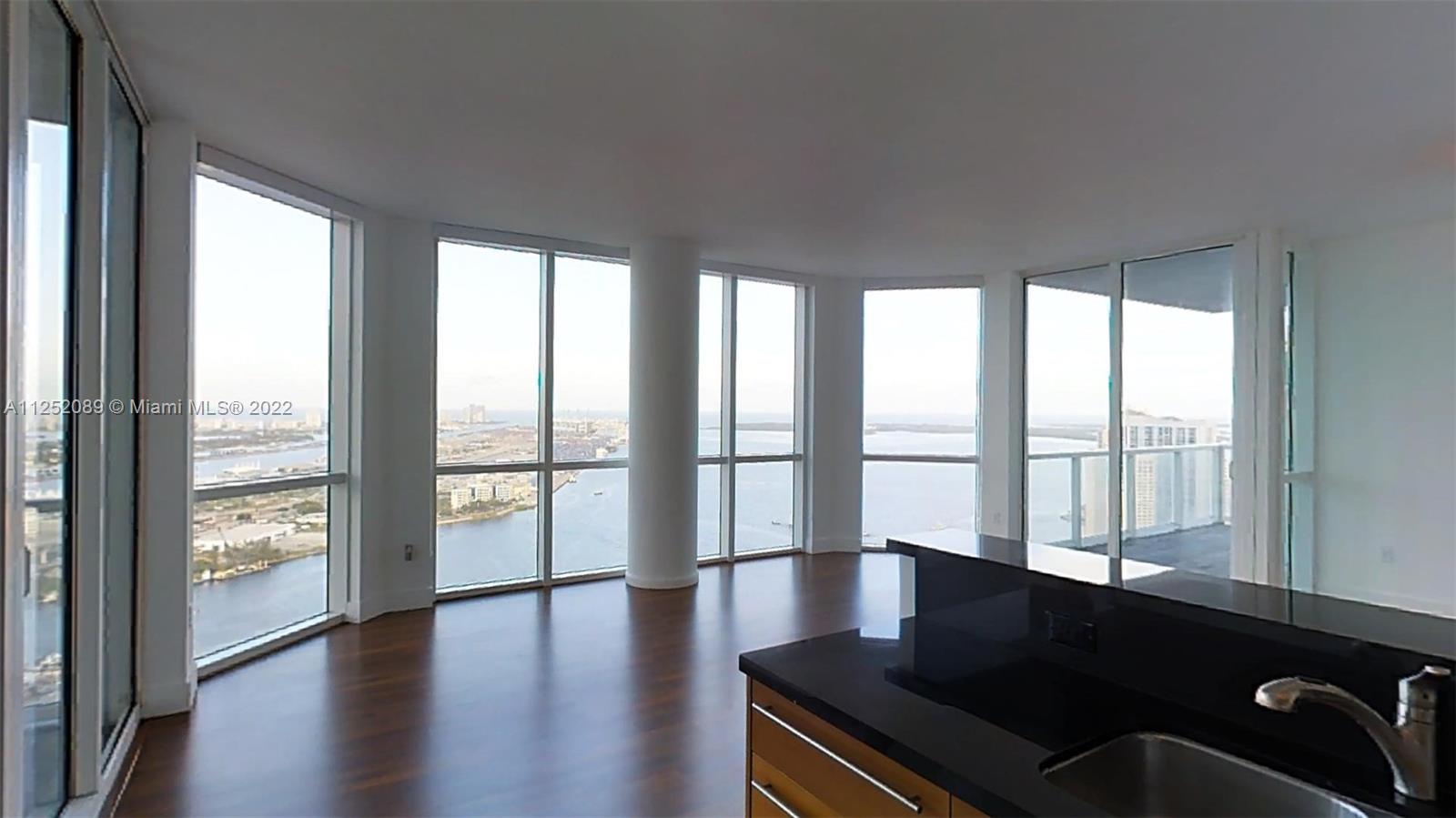 244 Biscayne Boulevard, Unit 4503 Miami, FL 33132 - Photo 14 of 33 a living room with a large window