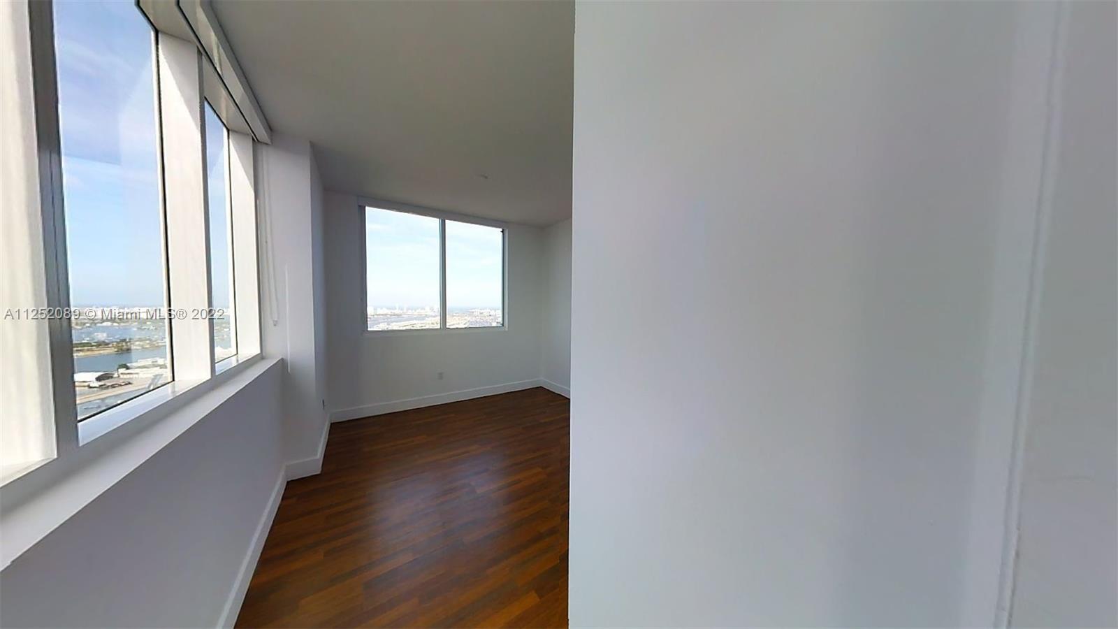 244 Biscayne Boulevard, Unit 4503 Miami, FL 33132 - Photo 32 of 33 a view of an empty room and window