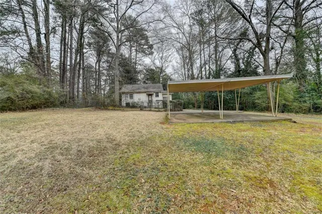 a house view with swimming pool in front of it