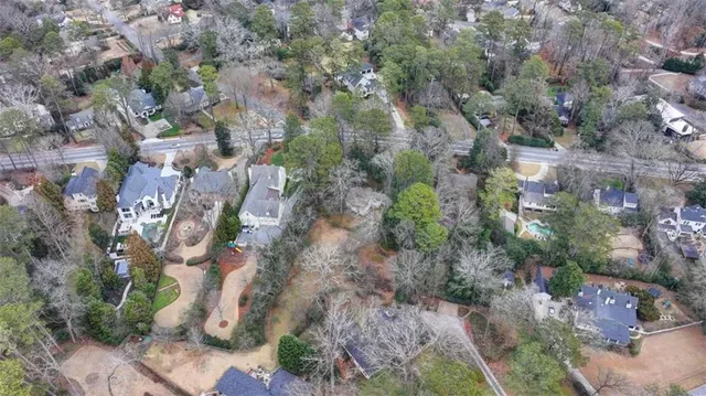 a backyard of a house with lots of trees