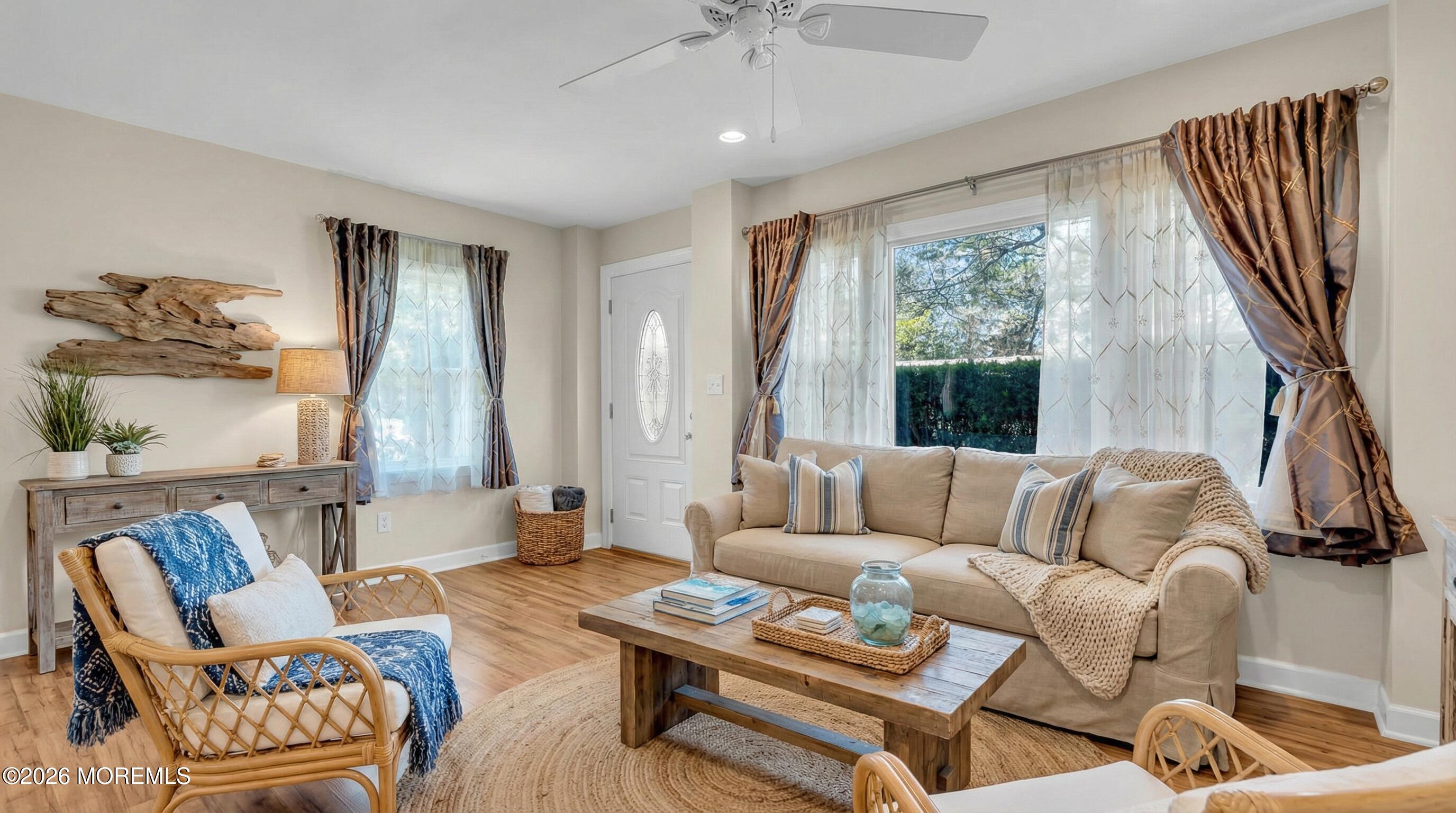 1407 Edgemere Road Wall, NJ 07719 - Photo 5 of 16 a living room with furniture and a large window