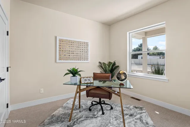 a workspace with furniture and a window